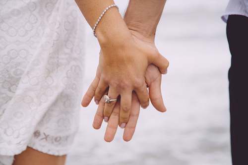 holding hands couple holding each hands grey
